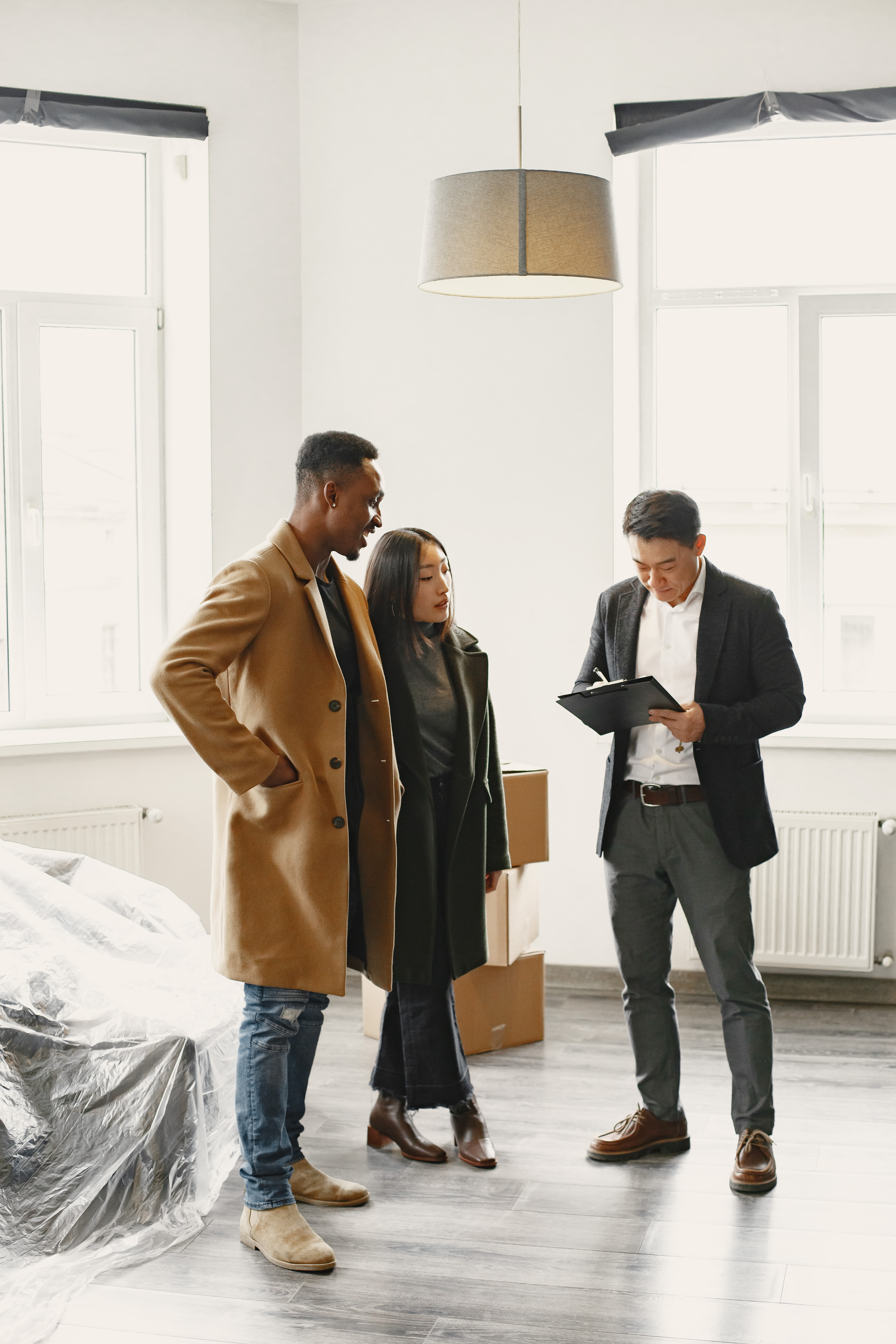 young-couple-buying-new-house-asian-woman-african-man-signing-documents-new-home